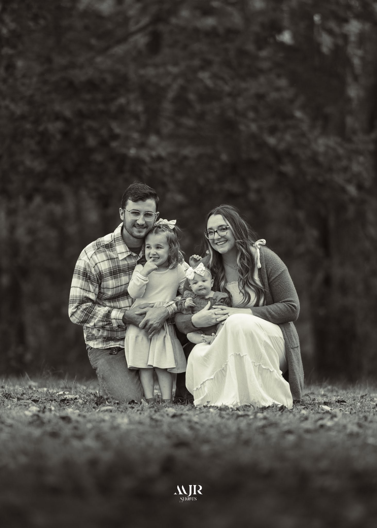 Black-and-white portrait of the Patterson family outdoors